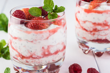 Chia pudding with strawberry sauce and berries.