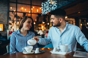 couple in cafeteria drinking tea