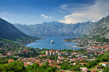 Fototapeta premium Fantastic aerial panoramic summer view from the mountain to the bay of Kotor, Mediterranean, Balkans, Montenegro, Europe. Traveling concept background. Incredible sunlight. Postcard.