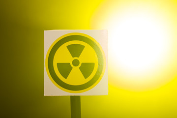 Radiation and danger concept - Radioactivity sign and the dramatic smokey background