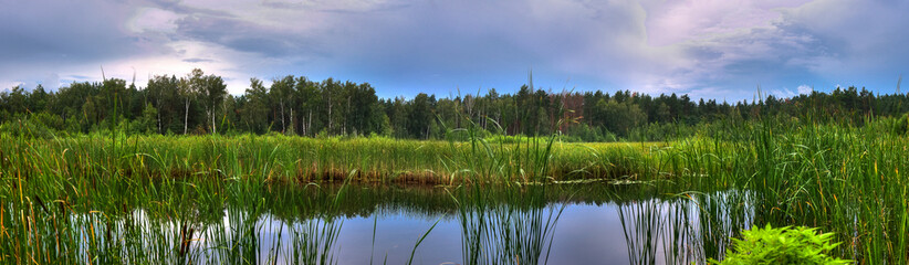 landscape panorama with lake and blue sky