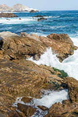  Ocean waves breaking on the rocks on the coast of Huarmey, Peru