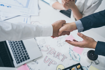 Start up and Successful Concept.Business people handshake of happy business people after contract agreement to become a partner,Finishing up a meeting,collaborative teamwork.