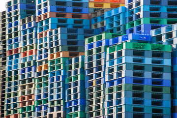 Industry plastic pallet stacked in factory warehouse for logistic shiping yard.  sale and rent used plastic pallet business.