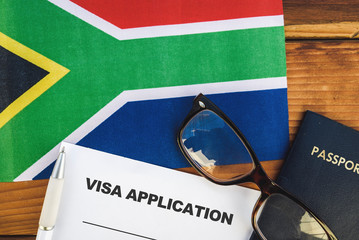 Flag of South Africa , visa application form and passport on table