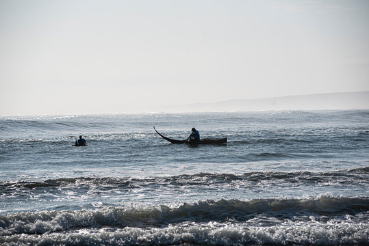 People fishing in traditional fishing boats called: Caballitos de Totora in Huanchaco, Trujillo.