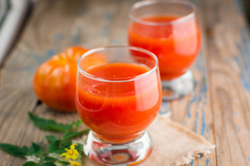 two glasses of freshly squeezed tomato juice