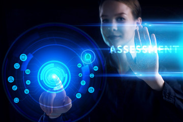 Business, Technology, Internet and network concept. Young businessman working on a virtual screen of the future and sees the inscription: Assessment