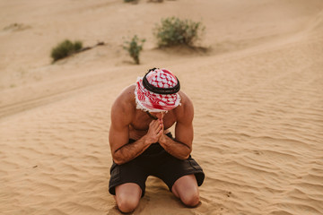 Young handsome man portrait on the desert