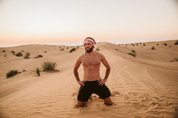 Young handsome man portrait on the desert