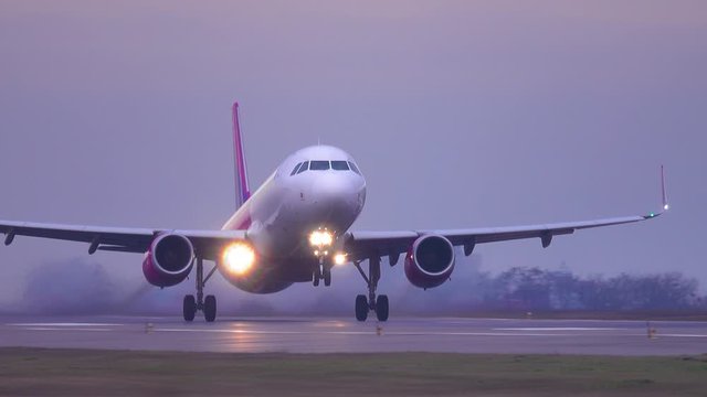 Airplane (aircraft) taking off at dusk