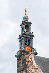Fototapeta na wymiar The bell tower of the Western Church, in Dutch Westerkerk in Amsterdam