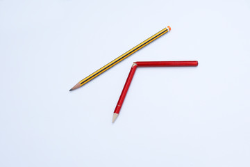 Broken pencils isolated on white background