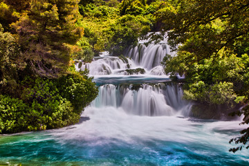 Fototapeta na wymiar Beautiful Skradinski Buk Waterfall In Krka National Park - Dalmatia Croatia, Europe. Beautiful long exposure panorama of waterfalls (milk effect). A true natural wonder. Amaizing sunlight view.