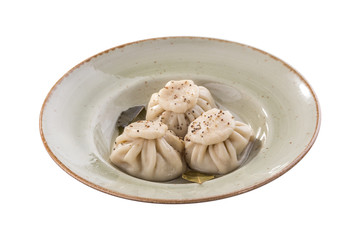 khinkali dumpling on grey plate isolated on white background