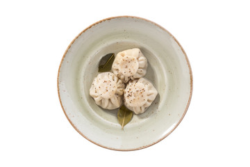 khinkali dumpling on grey plate isolated on white background