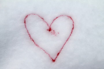 Red heart painted with red paint on snow symbol of love postcard for Valentines Day