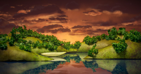 A landscape studio photo of a lake and hills with clouds made out of pears and greenery on plexiglass.