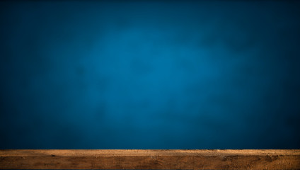 Empty wooden table top on blue background, template mock up for product display.