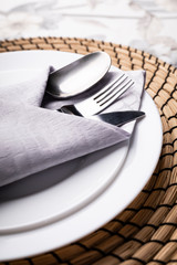 A table setting. A modern, elegant tableware for one person, close-up.