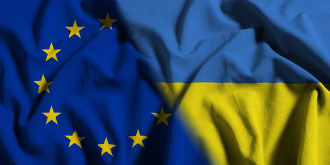 National flag of Ukraine with European Union (EU) flag on a waving cotton texture background