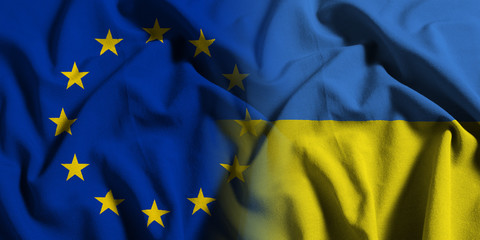 National flag of Ukraine with European Union (EU) flag on a waving cotton texture background