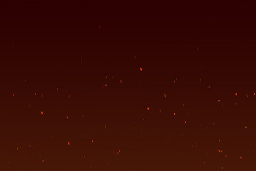 Burning red hot sparks fly from large fire in the night sky.