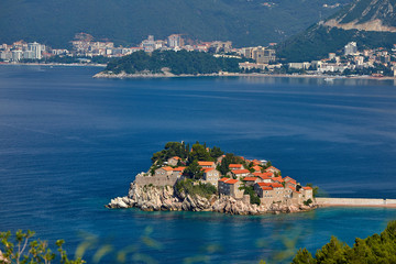 Amaizing sunset view on Sveti Stefan Island City. Small islet and resort in Montenegro. Balkans,...