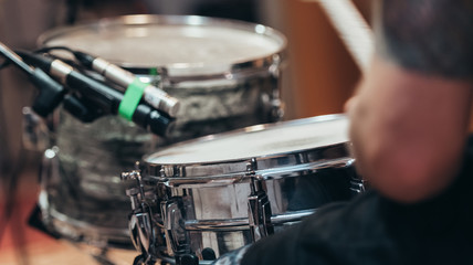 Fototapeta na wymiar Drummer recording drum session in studio