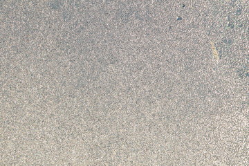 Blue window glass covered hoarfrost ice pattern texture. Cold nature winter background