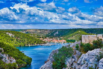 Sunlight view on the Sibenik Bridge a long concrete arch bridge passing through the canyon of the...