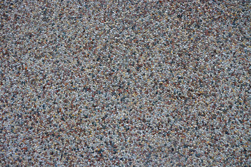 Background of small colorful stones. Many small stones