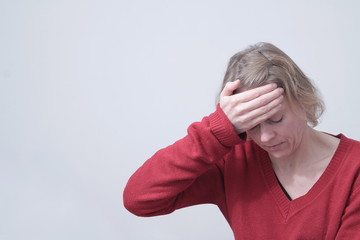 woman with headache on white background 