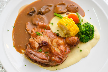 Chicken grill with broccoli, corn, carrot, mashed potato and mushroom sauce