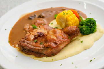 Chicken grill with broccoli, corn, carrot, mashed potato and mushroom sauce