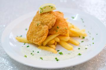 Fish and chips with french fries and tartar sauce