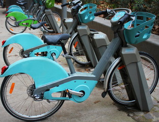 Charging urban electric battery bikes in the city. Eco transport