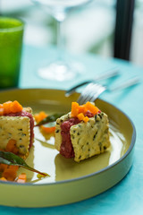  Italian food starter with meat tartare, vegetables and homemade crackers