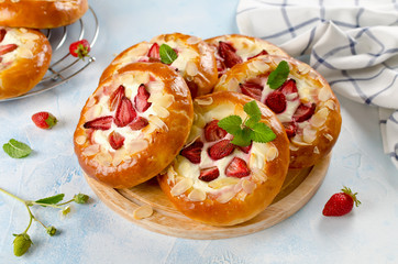 Homemade buns stuffed with cottage cheese and strawberries