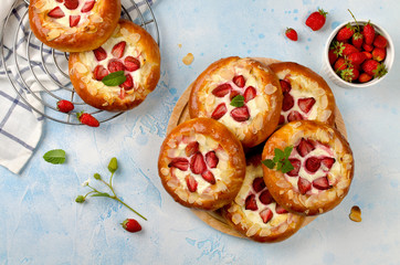 Homemade buns stuffed with cottage cheese and strawberries