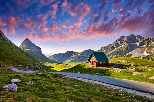 Amaizing sunset view on Durmitor mountains, National Park, Mediterranean, Montenegro, Balkans, Europe.  Bright summer view from Sedlo pass. Instagram picture. Way through the mountain. Colored clouds.