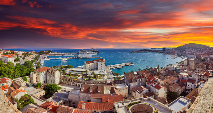 Split, Croatia. View of Split the second largest city of Croatia at dramatic sunlight. Shore of the Adriatic Sea and famous Palace of the Emperor Diocletian. Aerial view of Split coast