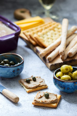 Chicken liver, onion and carrot paste, served with crackers, grissini, olives, capers and champagne.