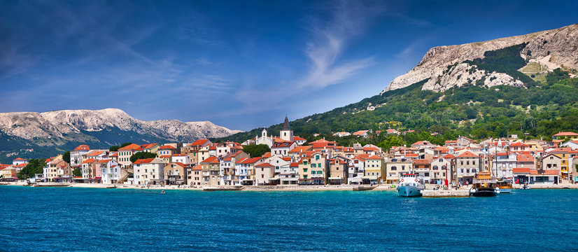 Panoramic view of Baska town. Bright summer seascape of Adriatic sea, Krk island, Kvarner bay archipelago, Croatia, Europe. Morning cityscape of Bashka town. Beautiful world of Mediterranean countries