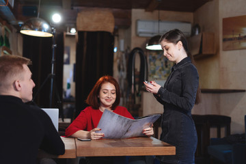 Waiter take order from customer in coffee shop,cafe owner writing drink order, Food and drink...
