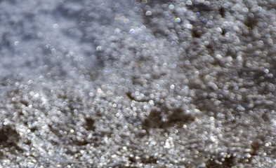 Abstract reflection of glare from the surface of the ice