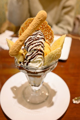 Chocolate banana parfait ice cream with topping.