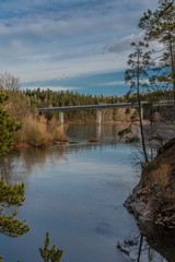 Fototapeta na wymiar Bridge over Rimov dam with blue sky in sunny winter day