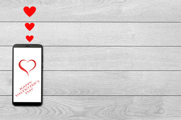Valentine day concept, love message - hearts flying out smartphone, Isolated on white wooden background