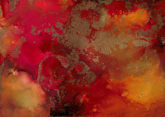 orange, red and gold alcohol ink splatter background